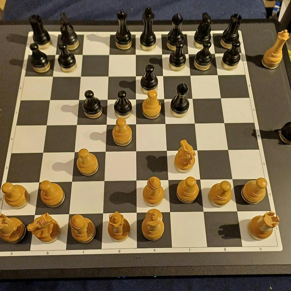 Advanced robotic chessboard with wooden chess pieces